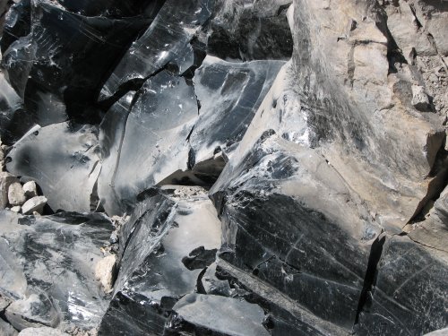 An unbelievable mountain of black glass